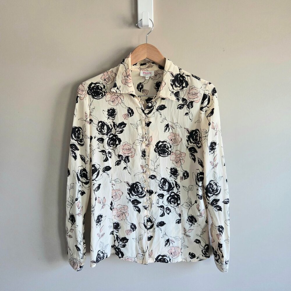 Cherie 100% silk designed in Italy button up blouse with floral design.